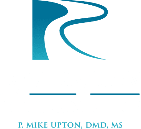 RiverView Orthodontics logo featuring the initials "R" and "V" in a modern design, emphasizing orthodontic care by P. Mike Upton, DMD, MS.