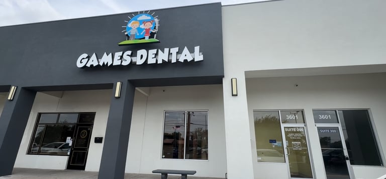 Exterior view of Games Dental pediatric dentistry office building with a modern storefront and logo.